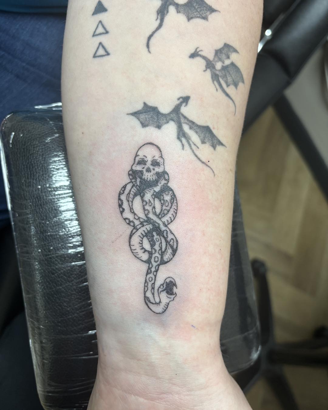 Skull and serpent piece