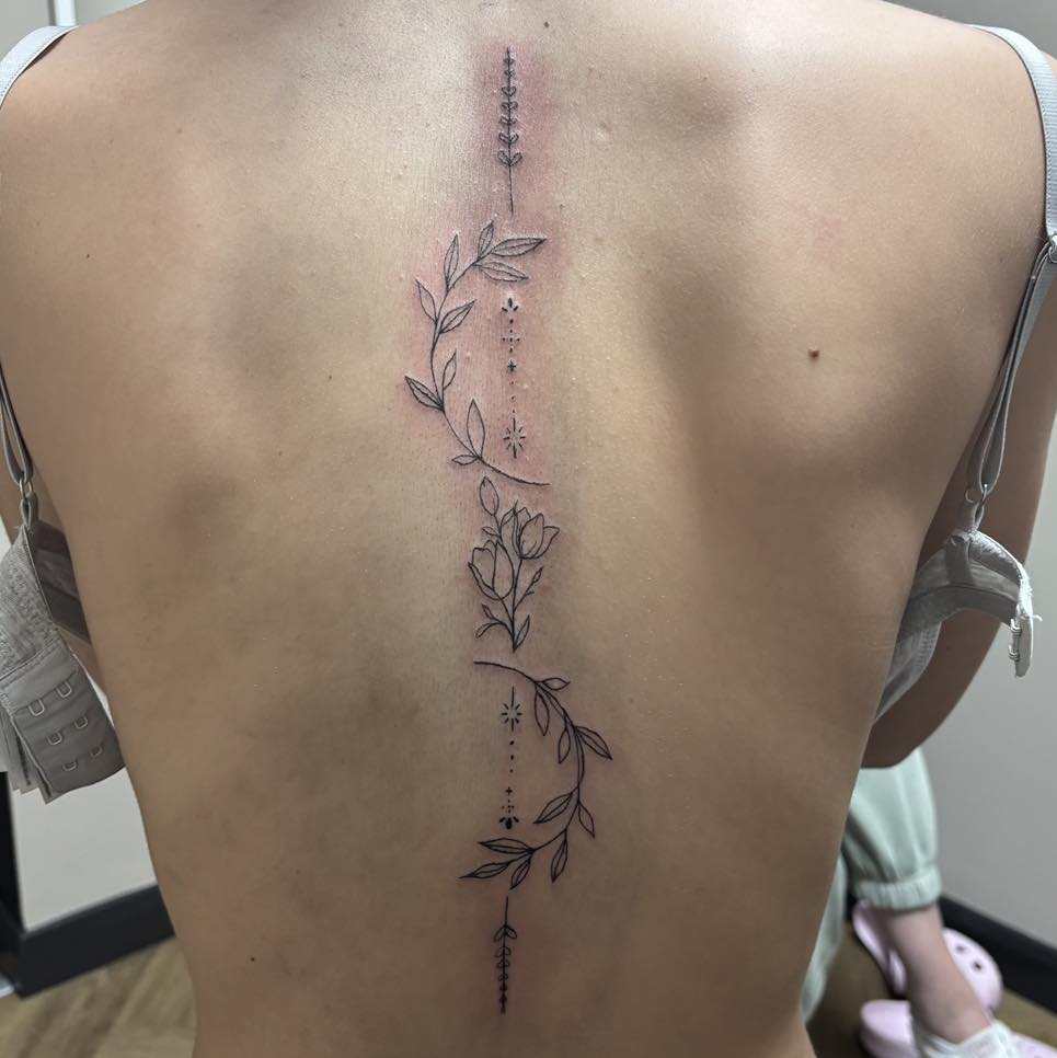 Fine line botanical spine piece